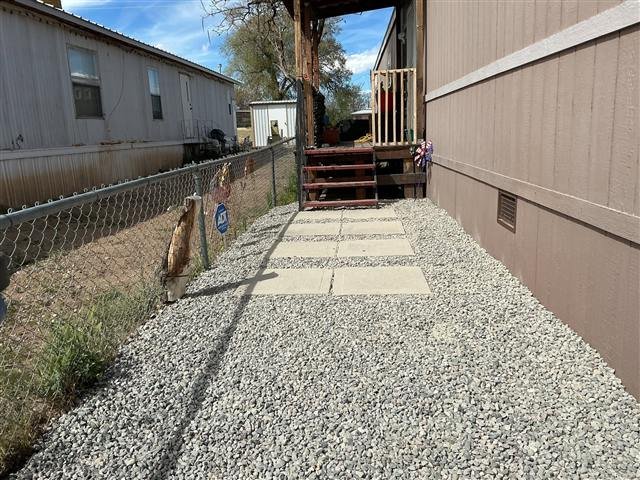 Gravel side yard with stepping stones